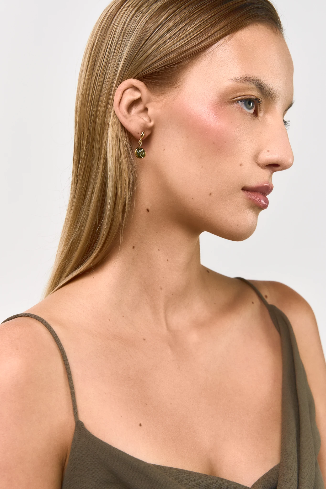 Thumbnail of Amore gold earrings with green amber