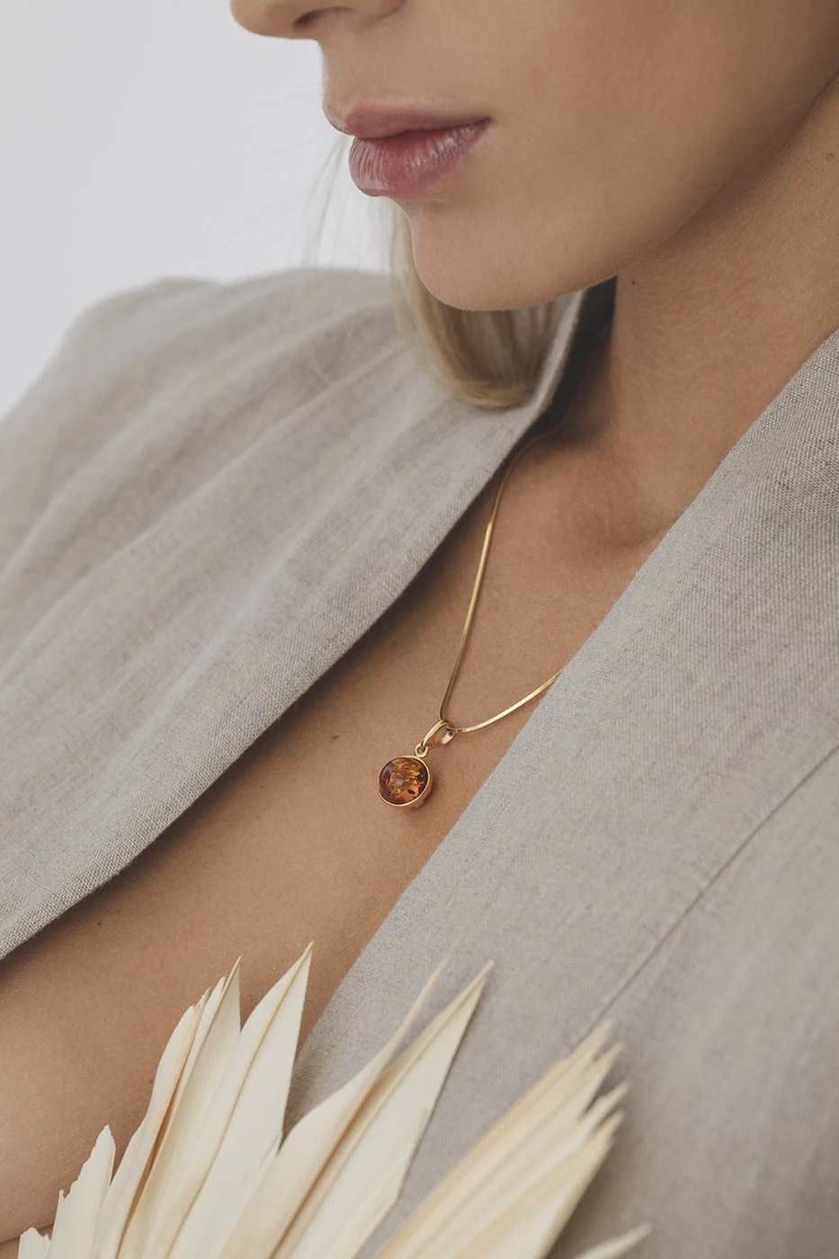 Chloe gold necklace with cognac amber