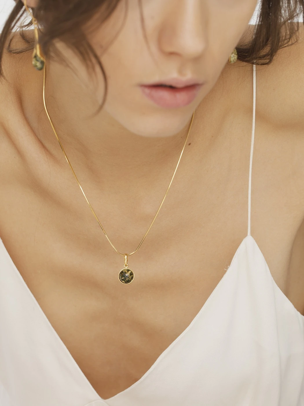 Chloe gold necklace with green amber