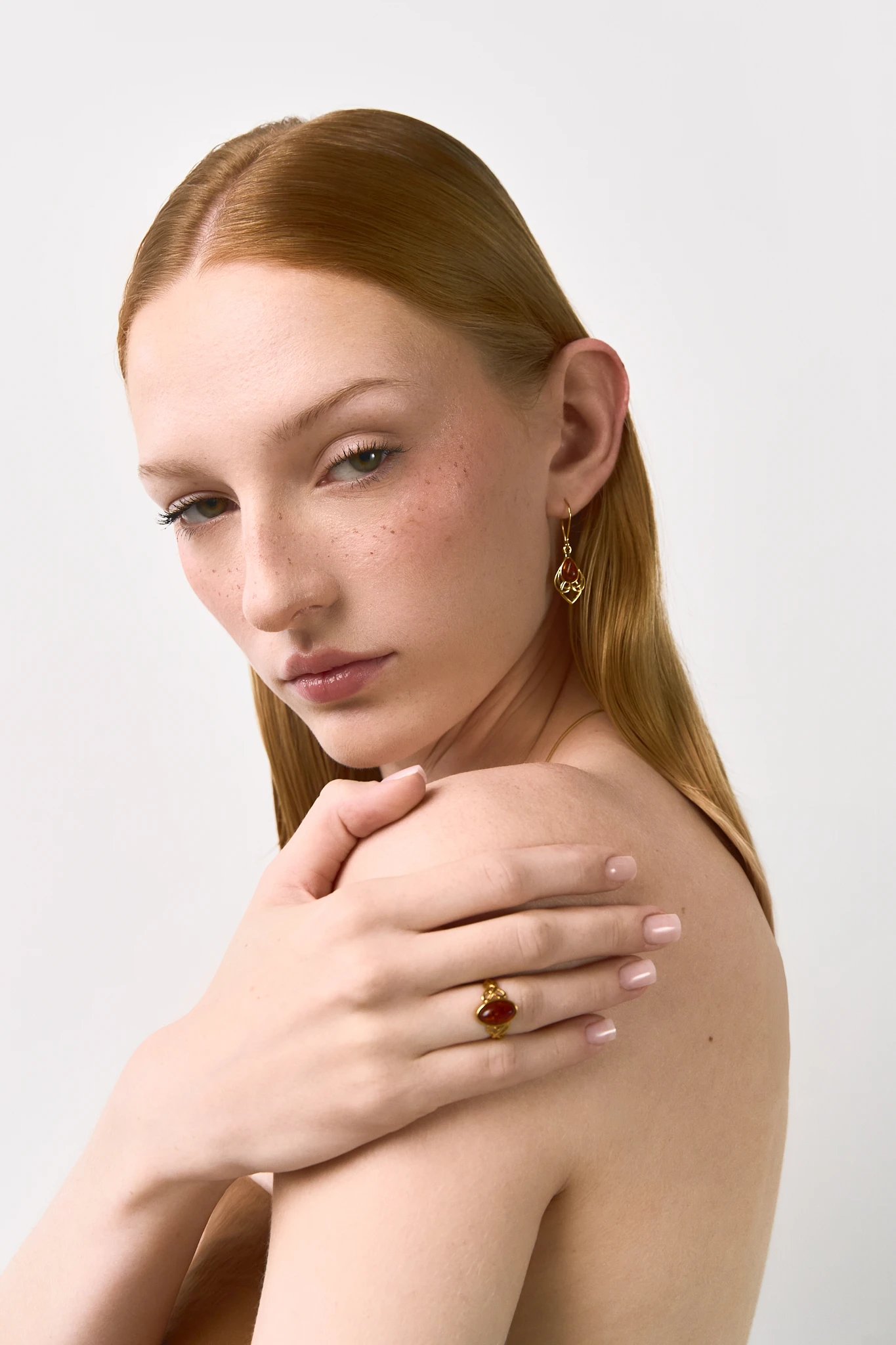 Eternal beauty meets Viking symbolism with these gold earrings featuring Baltic amber 🌟 Handcrafted, nickel-free, and perfect for sensitive ears. Unique piece inspired by Scandinavian history! #AmberEarrings #VikingInspired