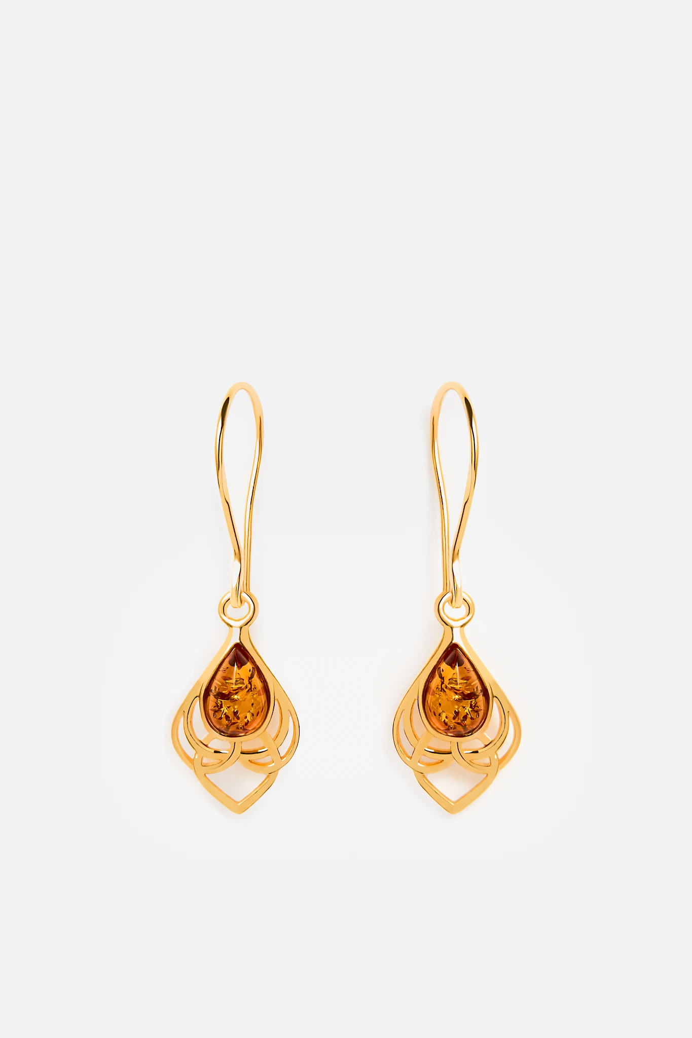 Eternal beauty meets Viking symbolism with these gold earrings featuring Baltic amber 🌟 Handcrafted, nickel-free, and perfect for sensitive ears. Unique piece inspired by Scandinavian history! #AmberEarrings #VikingInspired