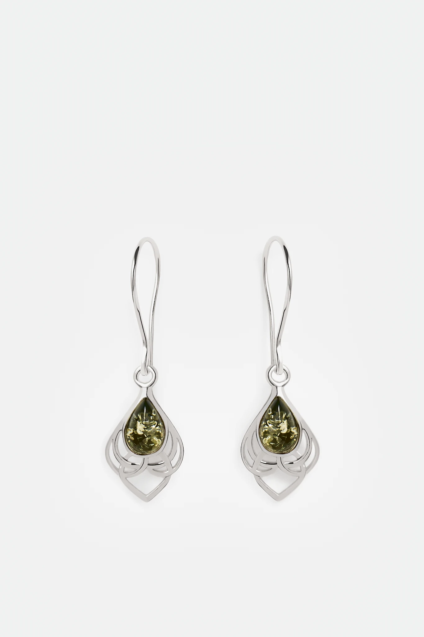 "Embrace eternity and balance with our hand-made sterling silver earrings featuring unique green amber 🌿 Nickel-free and inspired by Viking symbolism. Perfect for sensitive skin. #AmberEarrings" 🌟