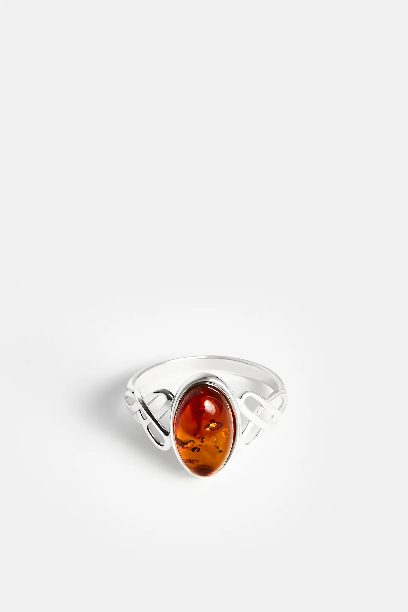 Connection silver ring with cognac amber