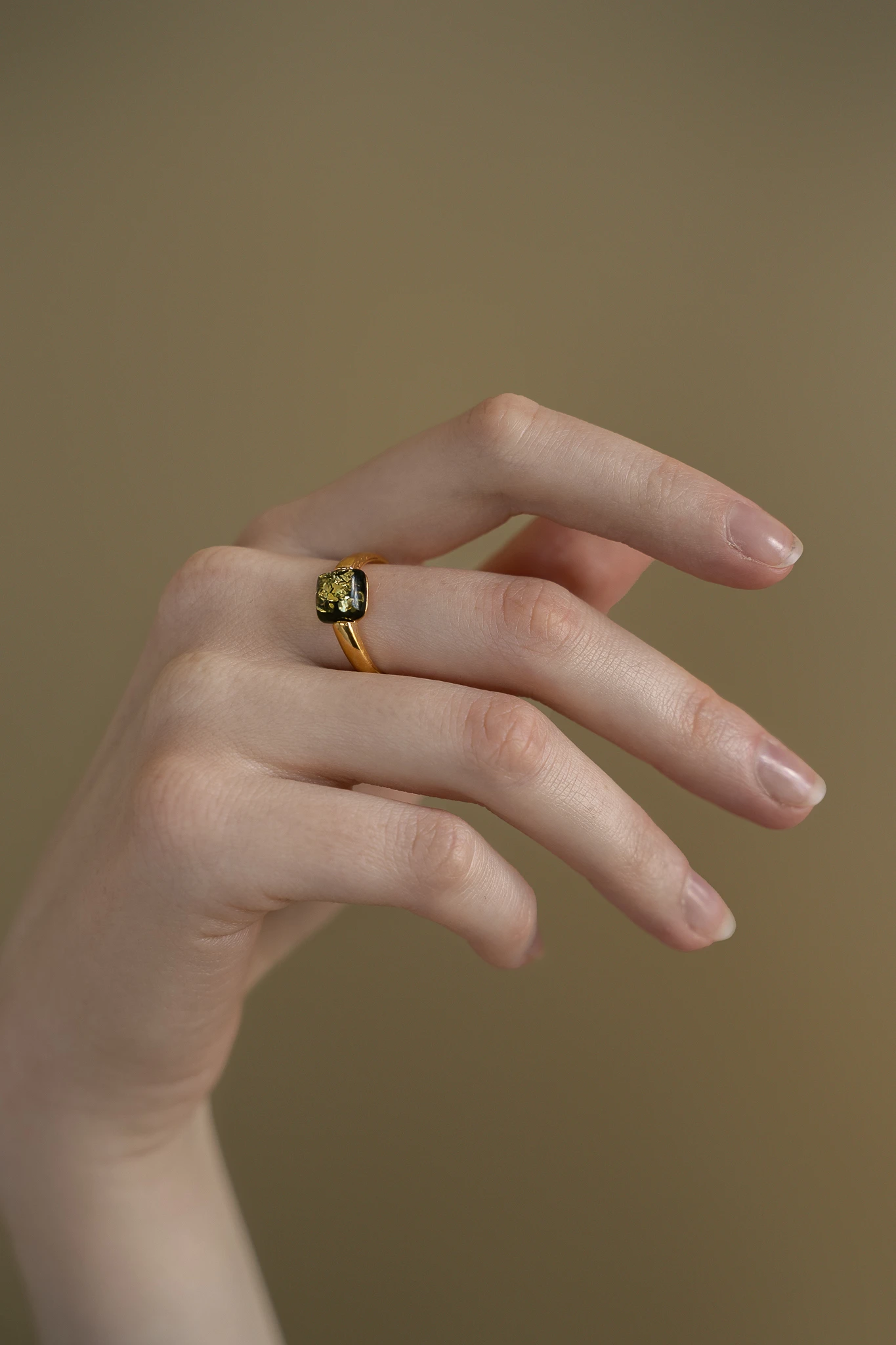 Cornelia ring with green amber