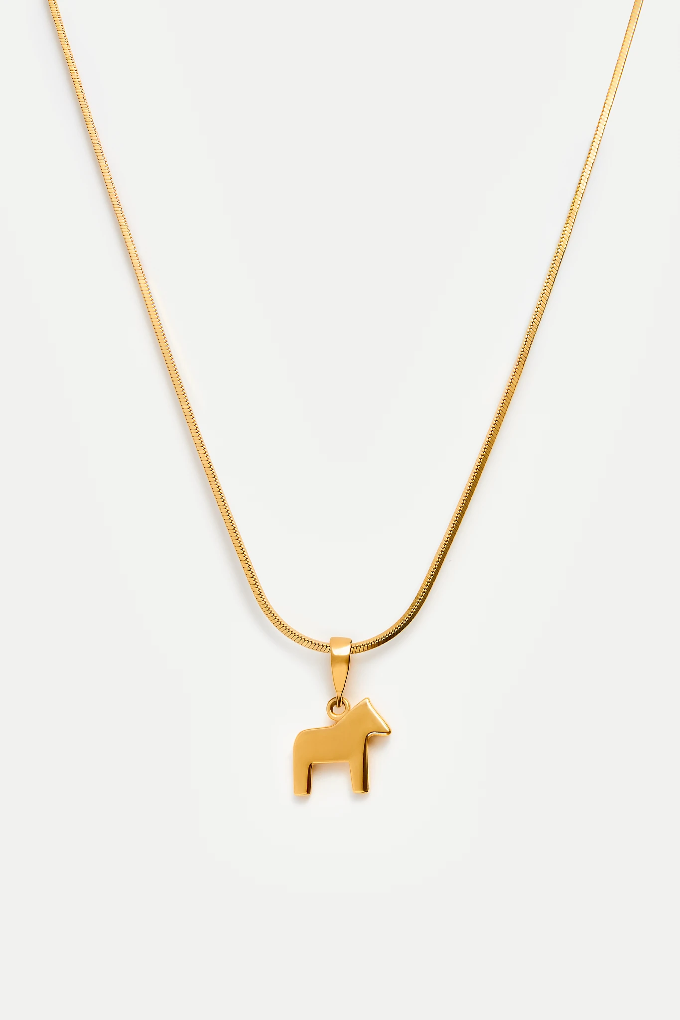 Dala horse necklace in gold 