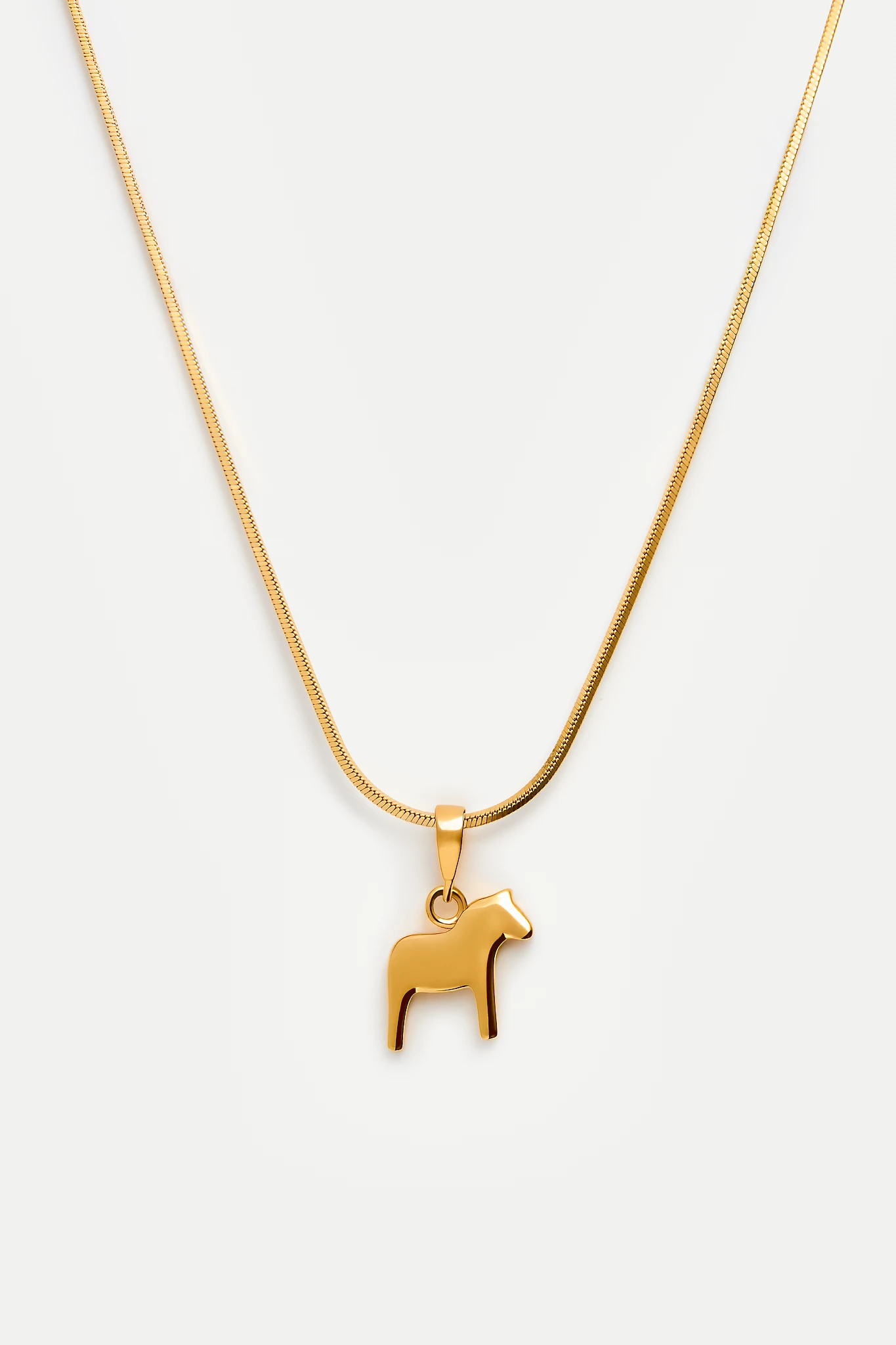 Dala horse necklace in gold