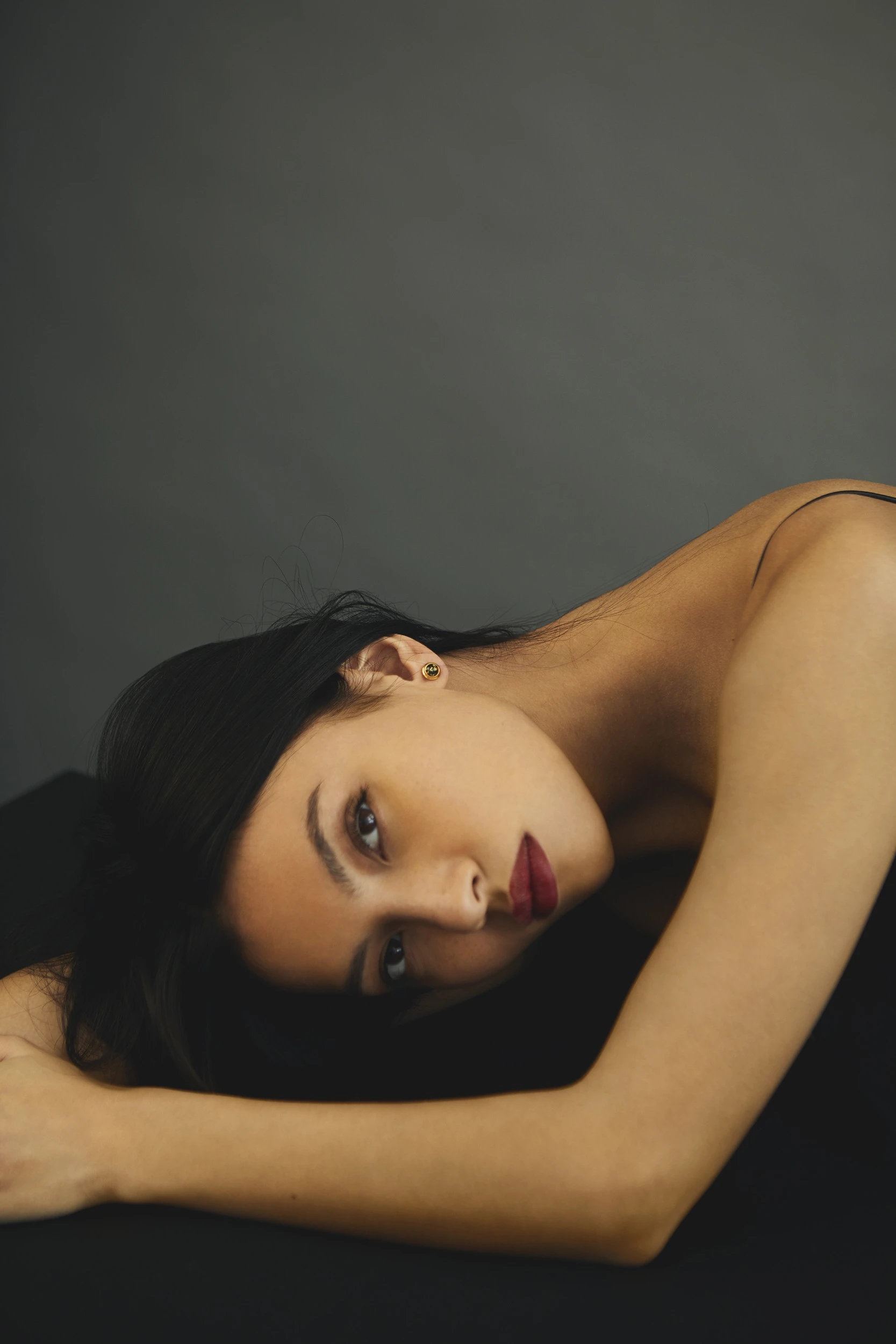 Thumbnail of Dot studs with green amber