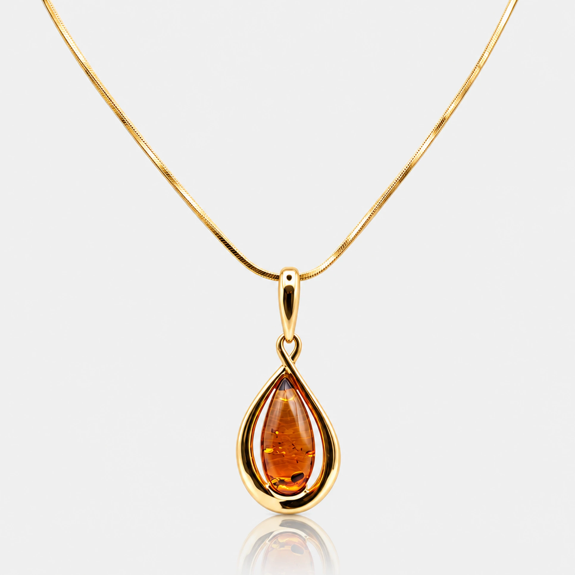 Collana a goccia dorata con ambra cognac