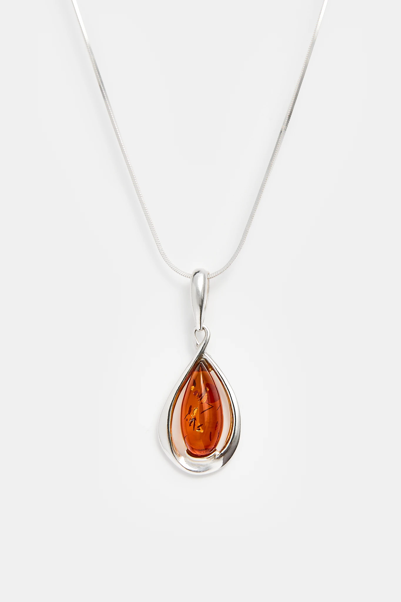 Drop silver necklace with cognac amber