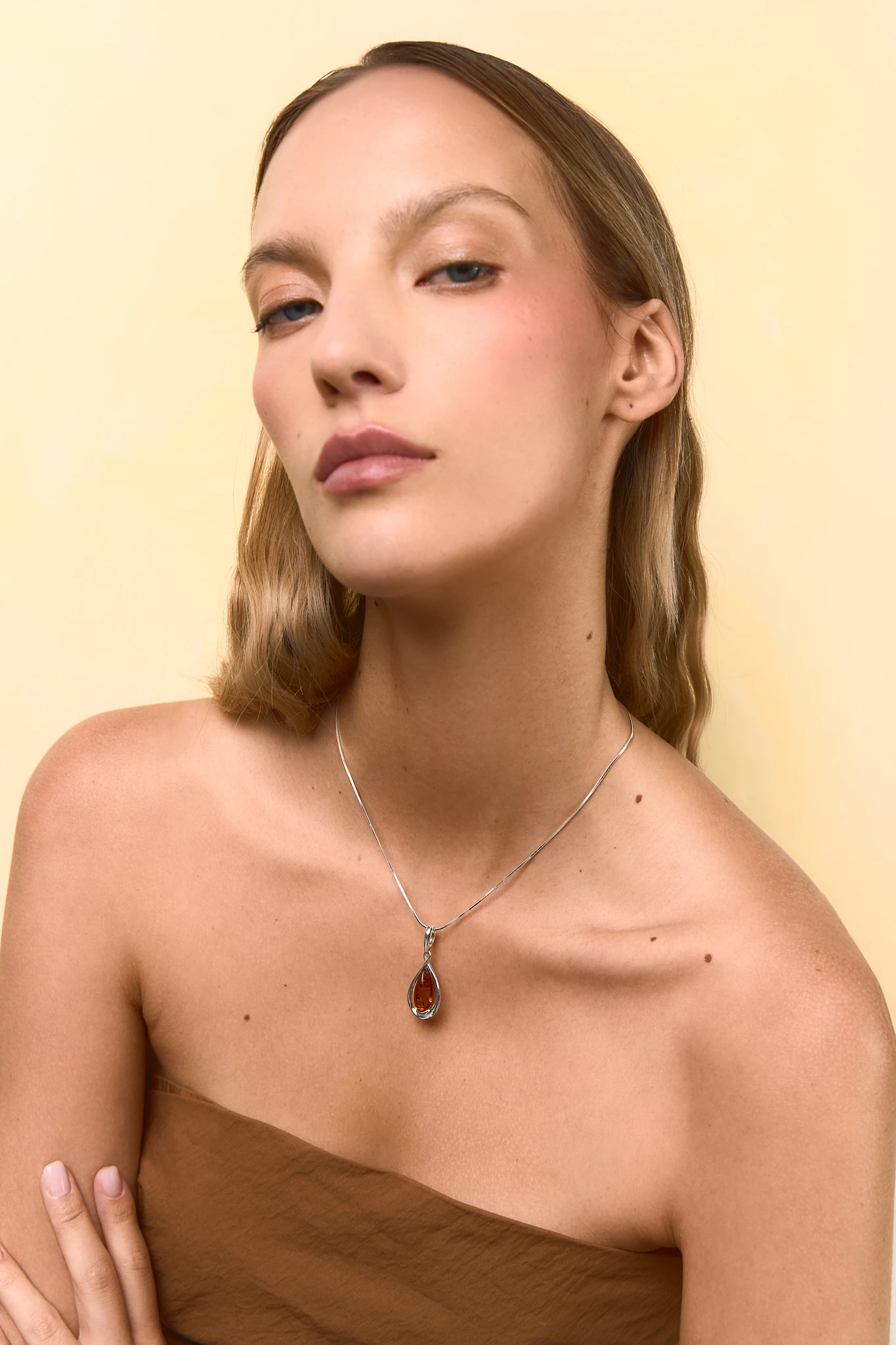 Drop silver necklace with cognac amber