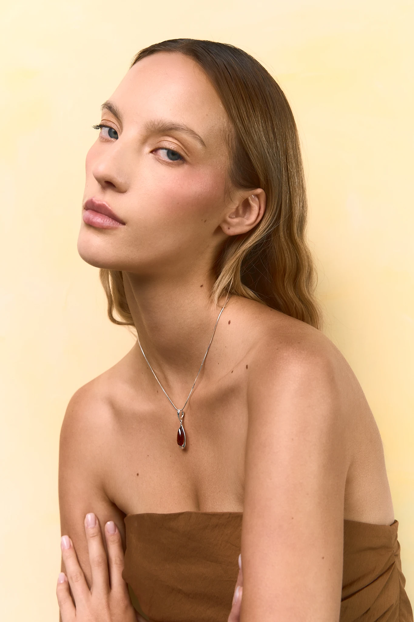 Drop silver necklace with cognac amber