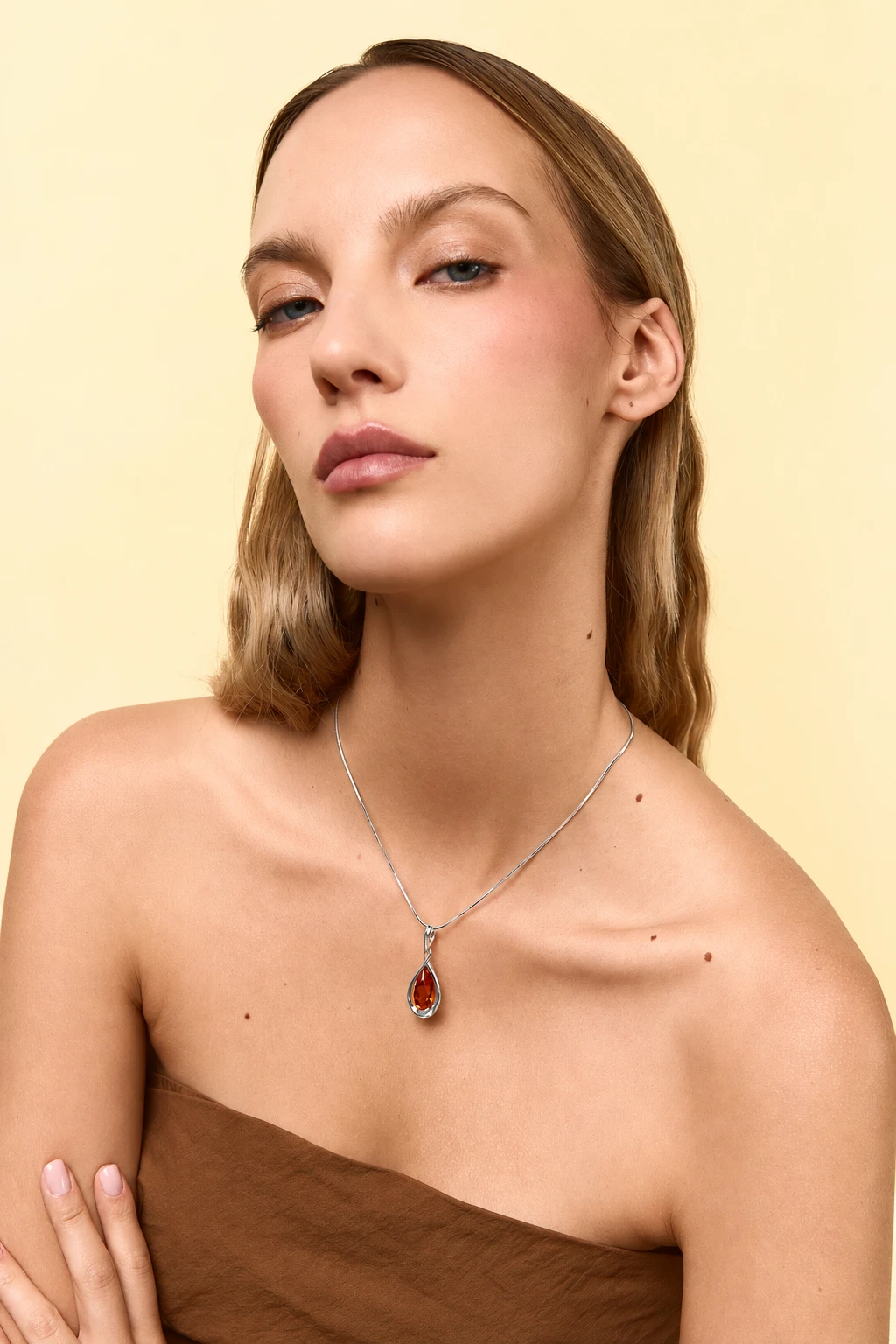 Drop silver necklace with cognac amber
