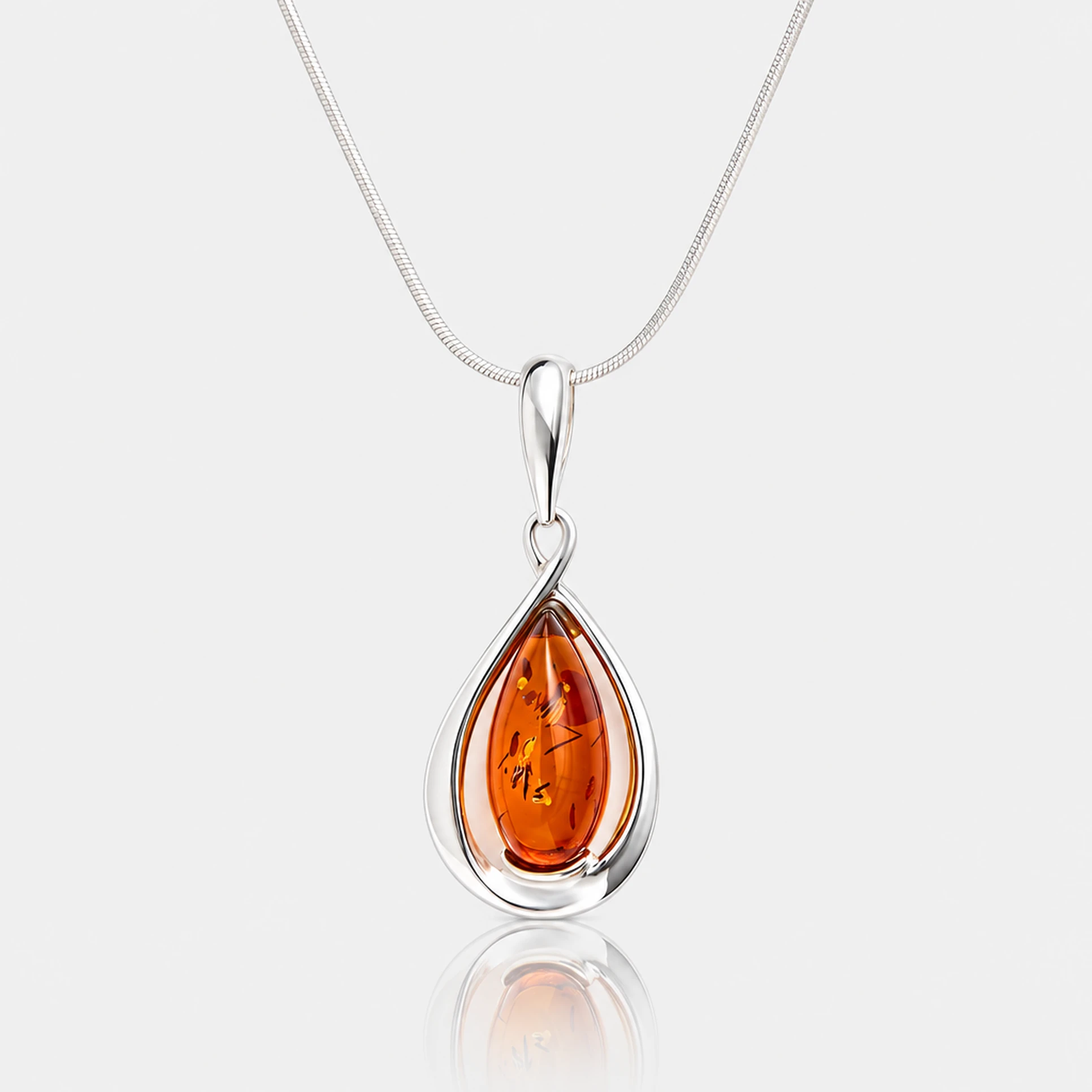 Drop silver necklace with cognac amber
