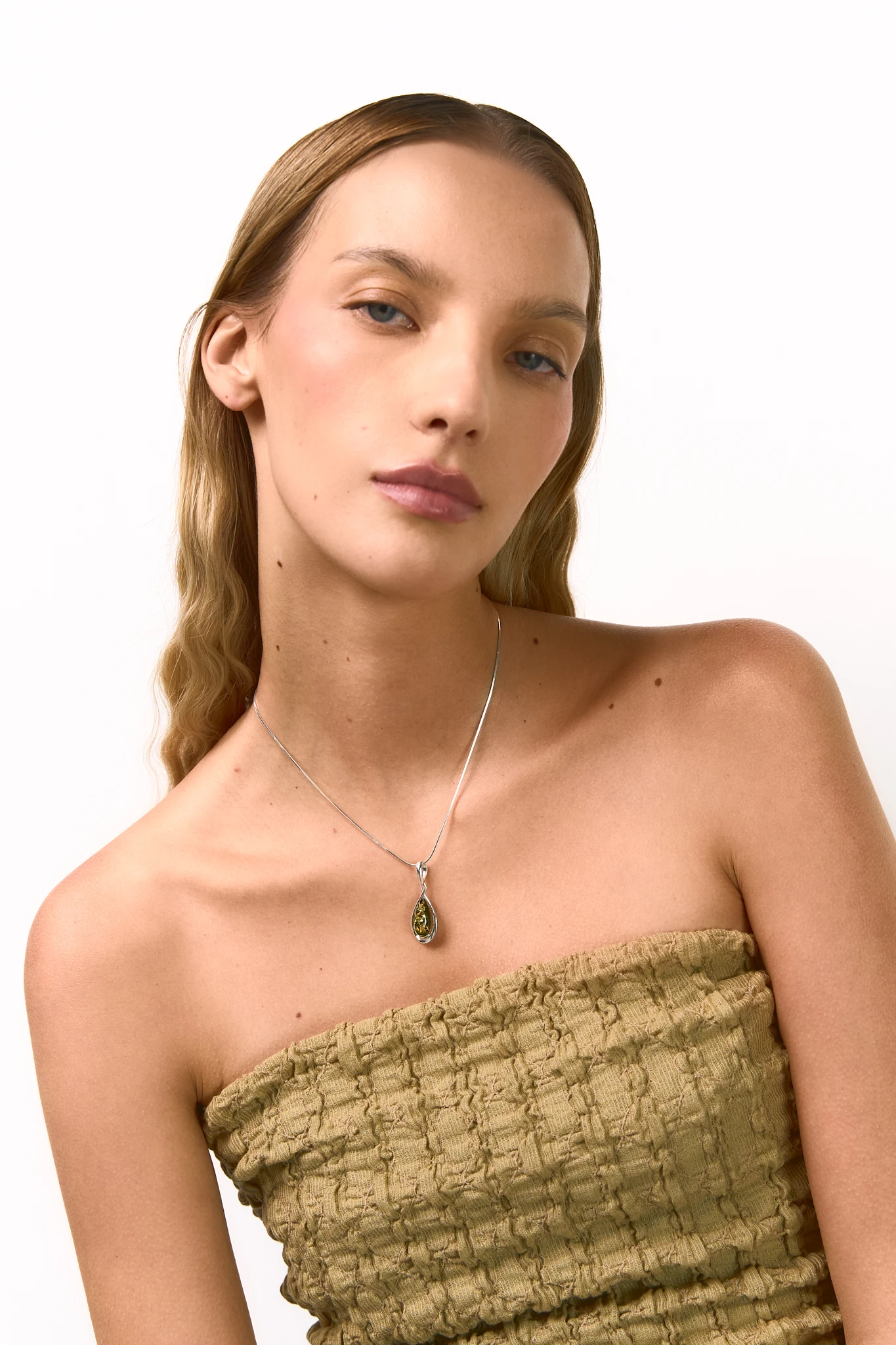 Drop silver necklace with green amber