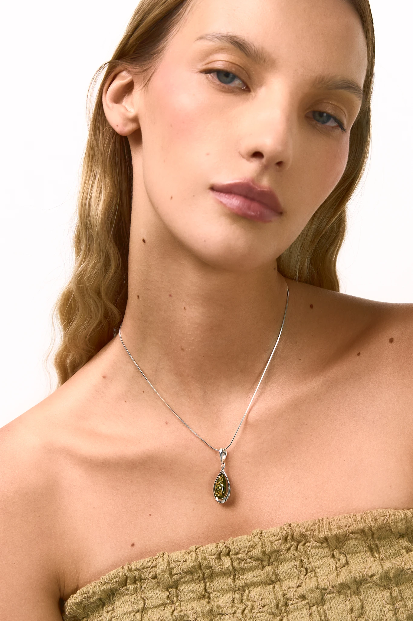 Drop silver necklace with green amber
