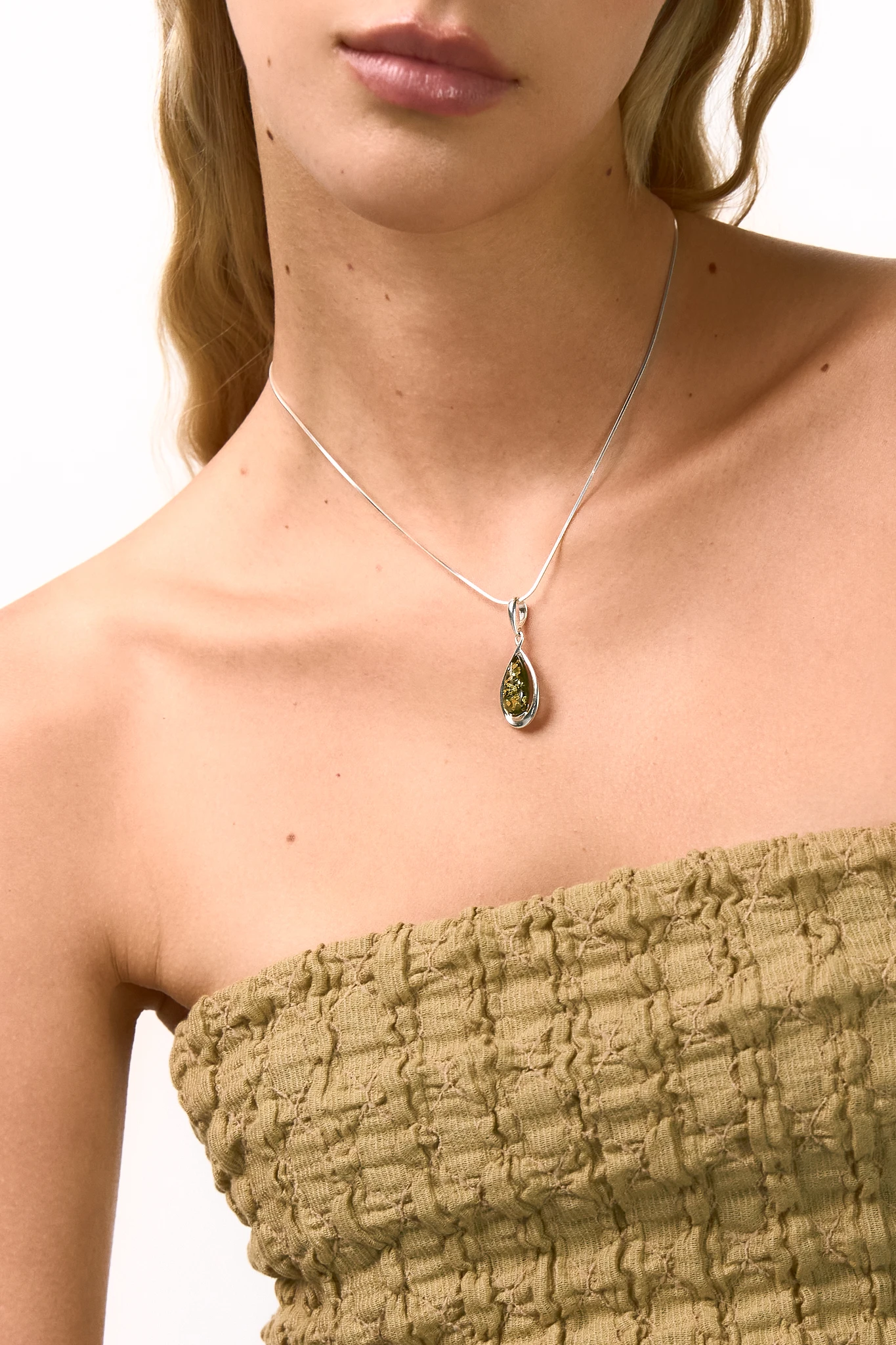 Drop silver necklace with green amber