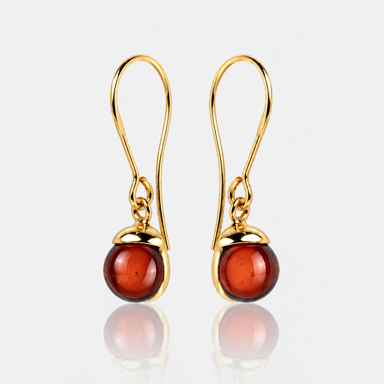 Diana gold earrings with cherry amber