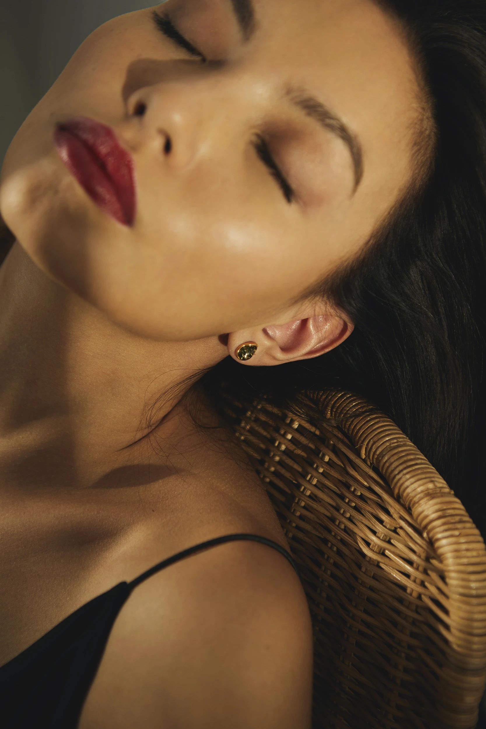 Gold stud earrings with green Baltic amber