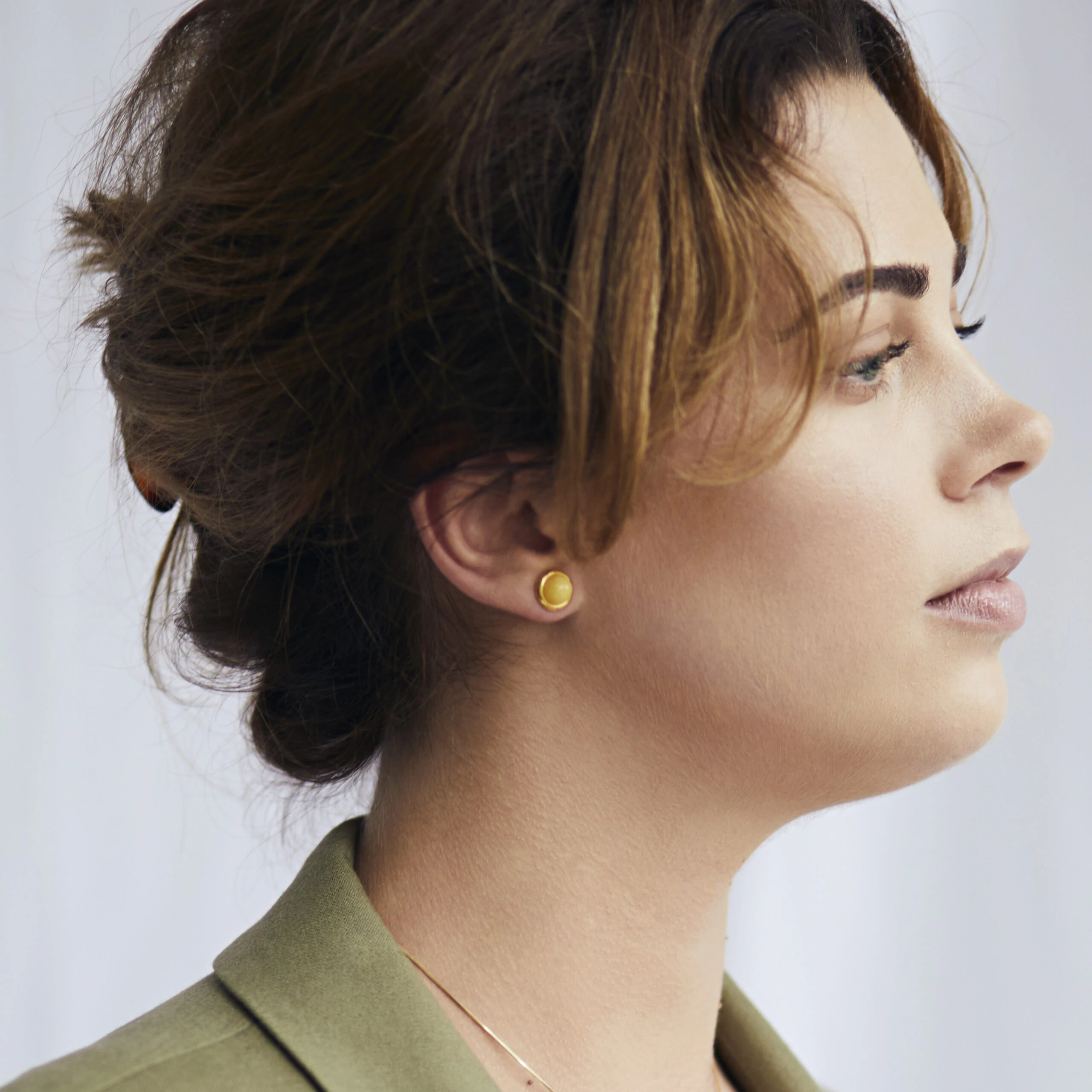 Thumbnail of Gold stud earrings with milky amber