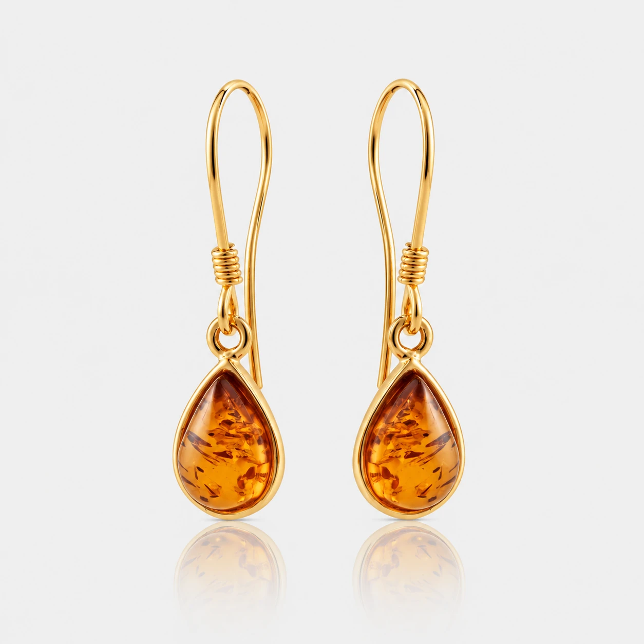 Merci gold earrings with cognac amber