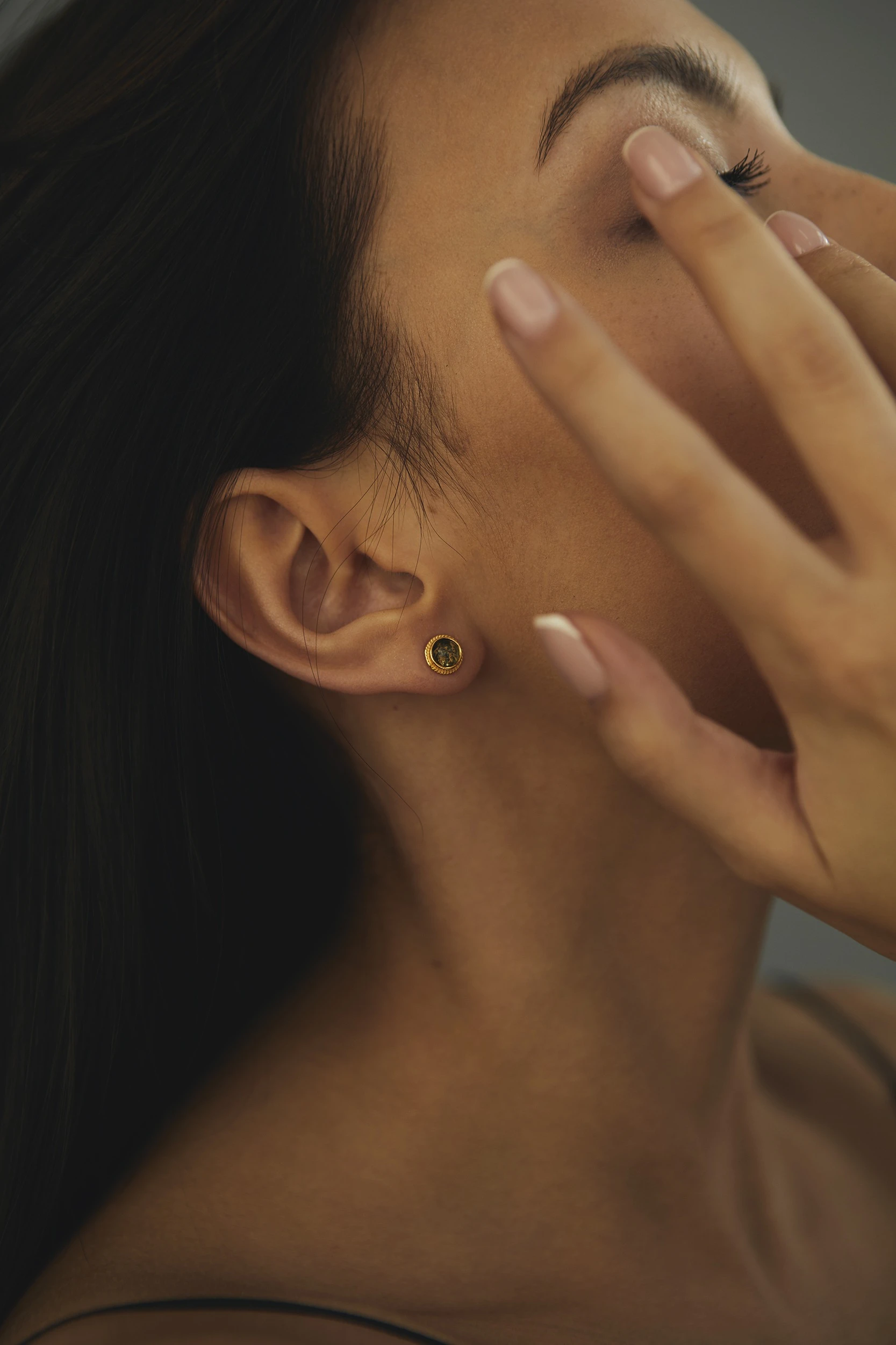 Thumbnail of Mini studs in gold with green amber