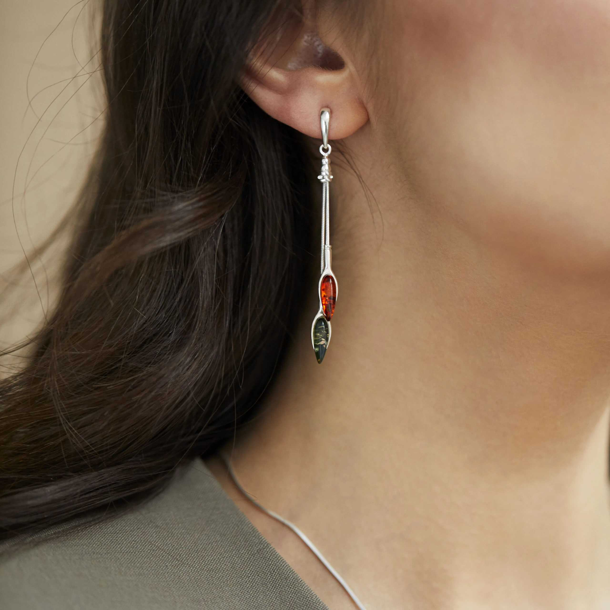 Silver earrings with cognac and green amber