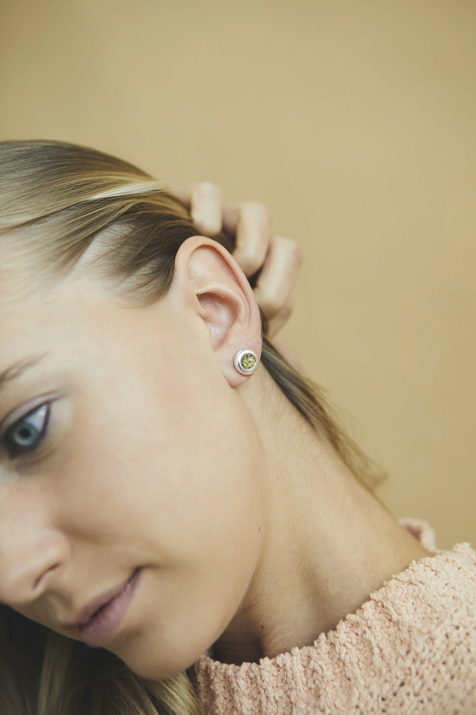 Silver stud earrings with green Baltic amber