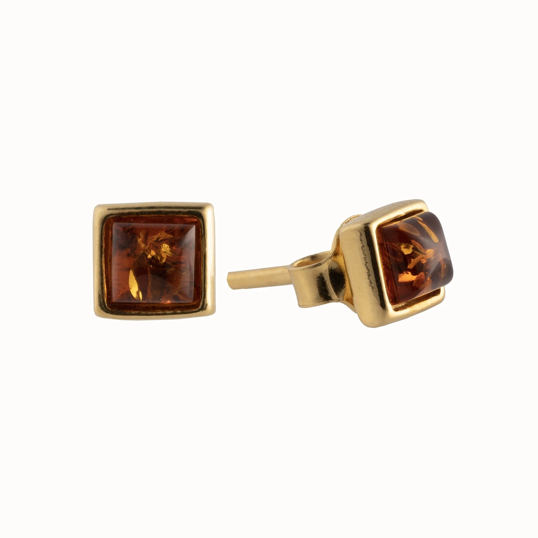 Miniatyrbild av Kvadratiska, små guldörhängen med cognac bärnsten