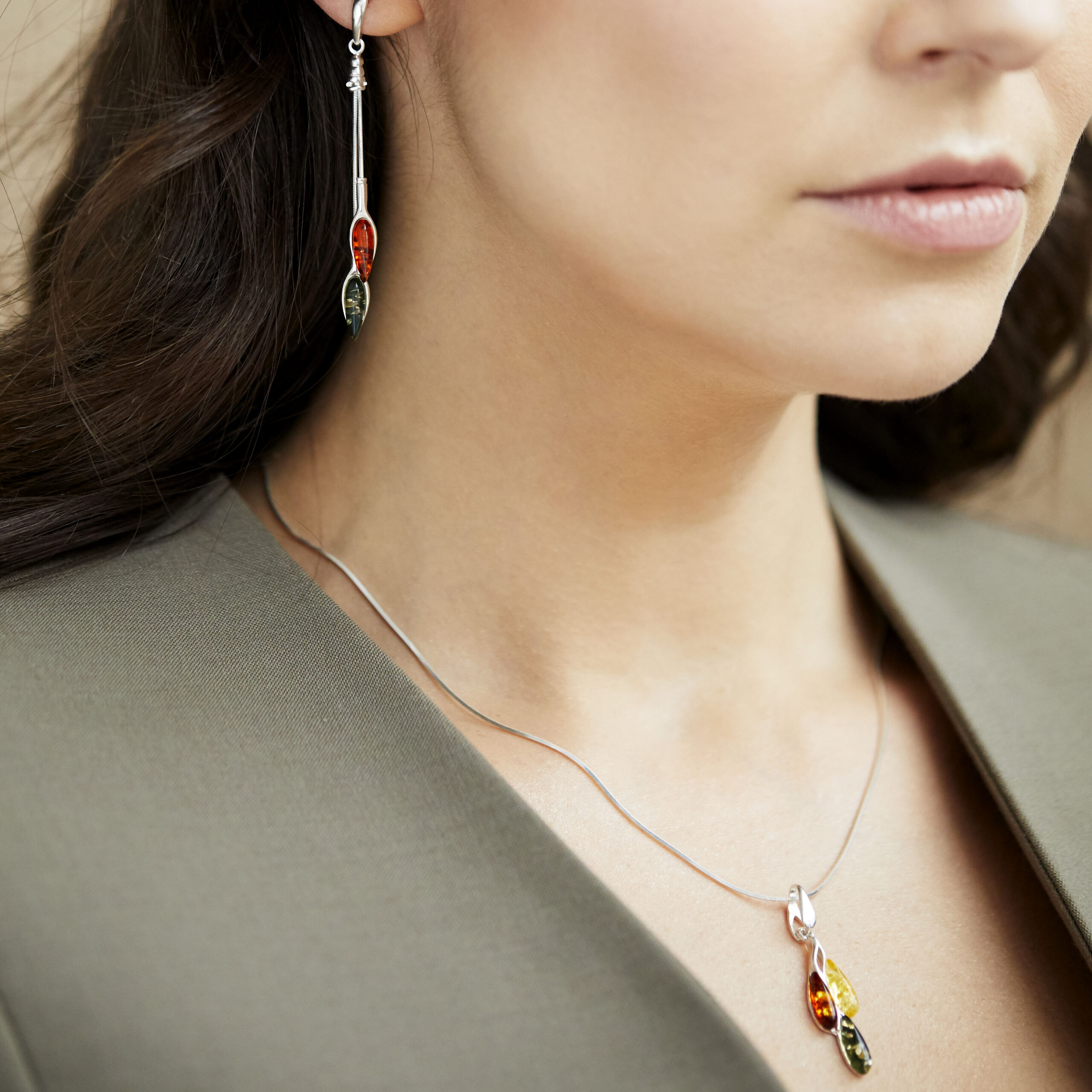 Thumbnail of Silver earrings with cognac and green amber